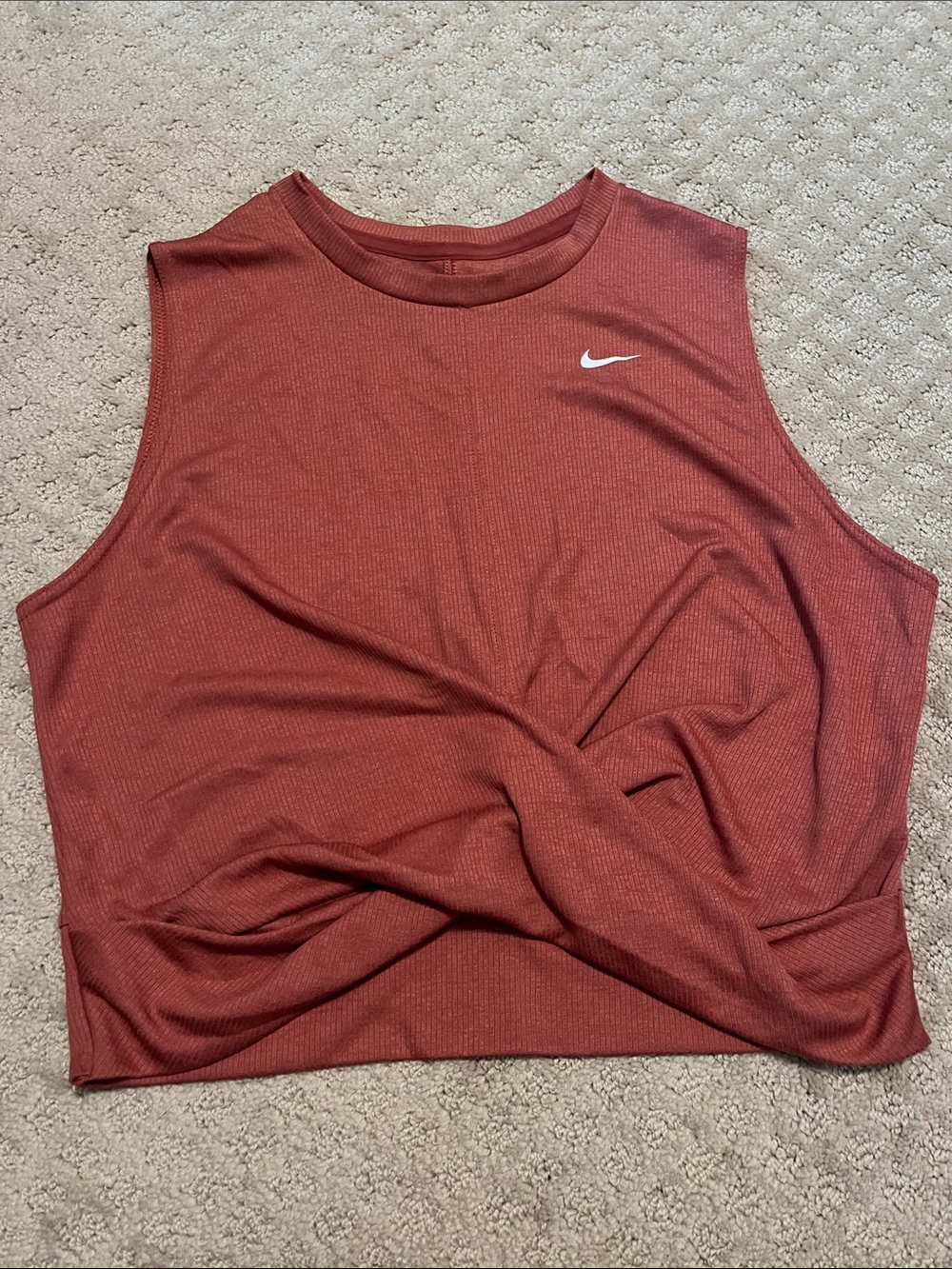 Nike Womenโs Ribbed Crop Tank Top in Rust Pink